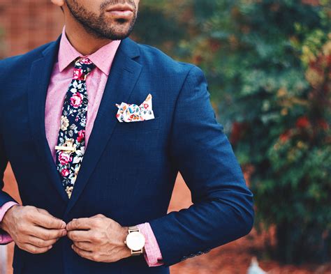 blue suit pink shirt tie.